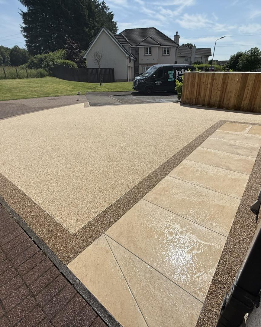 Recent Indie Paving resin driveway with contrasting border and porcelain path